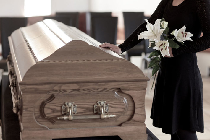 Coffin and woman